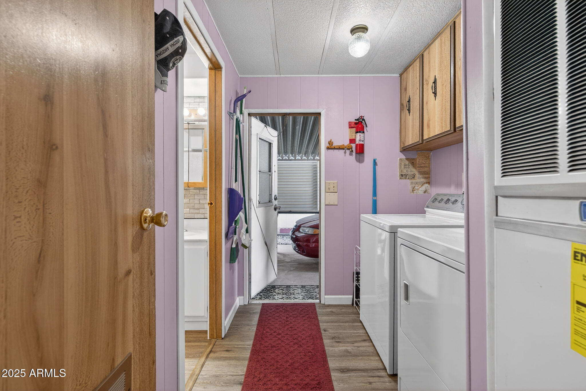 2100 North Trekell Road, Unit 131 Casa Grande, AZ 85122 - Photo 28 of 46 a hallway with washer and dryer next to a window