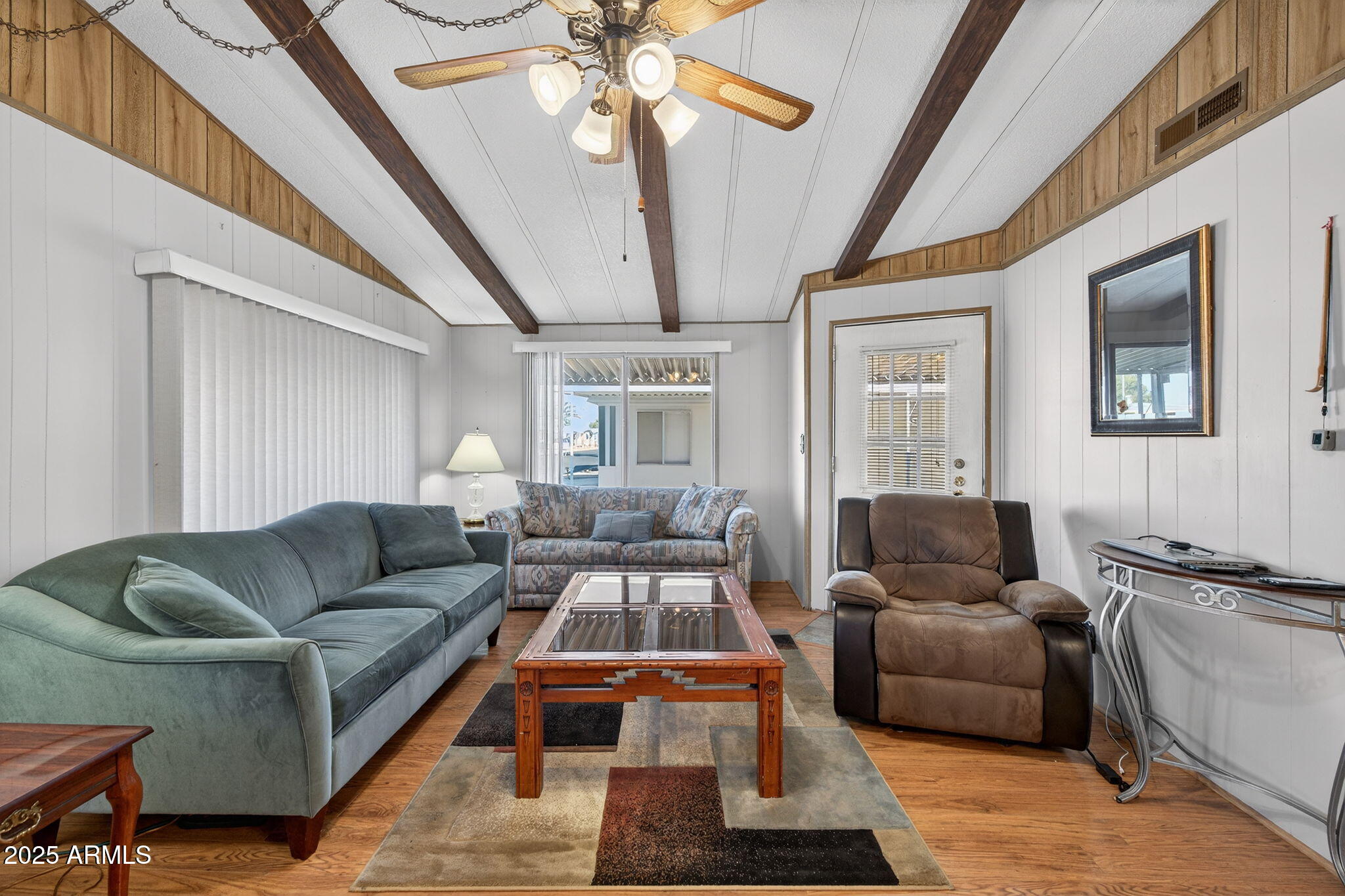 2100 North Trekell Road, Unit 131 Casa Grande, AZ 85122 - Photo 29 of 46 a living room with furniture and a chandelier