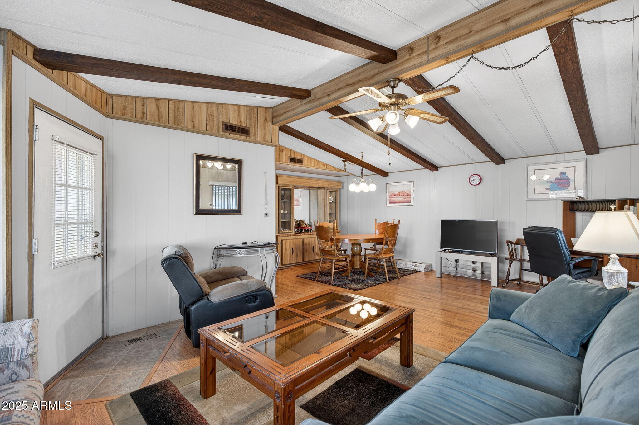 2100 North Trekell Road, Unit 131 Casa Grande, AZ 85122 - Photo 30 of 46 a living room with furniture a flat screen tv and a table
