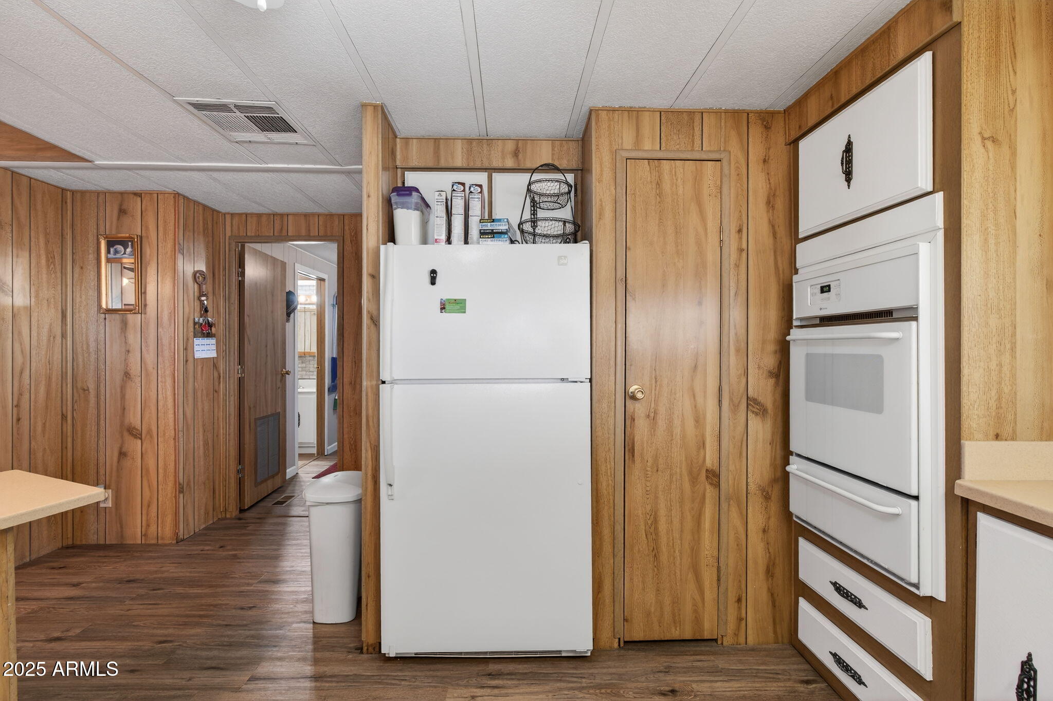 2100 North Trekell Road, Unit 131 Casa Grande, AZ 85122 - Photo 9 of 46 a view of a hallway with wooden floor and staircase