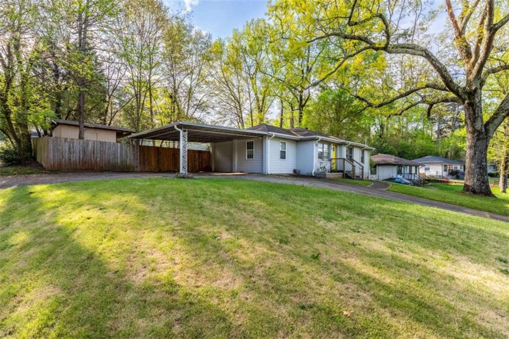1650 San Gabriel Avenue Decatur, GA 30032 - Photo 1 of 1 a view of a house with a yard and trees