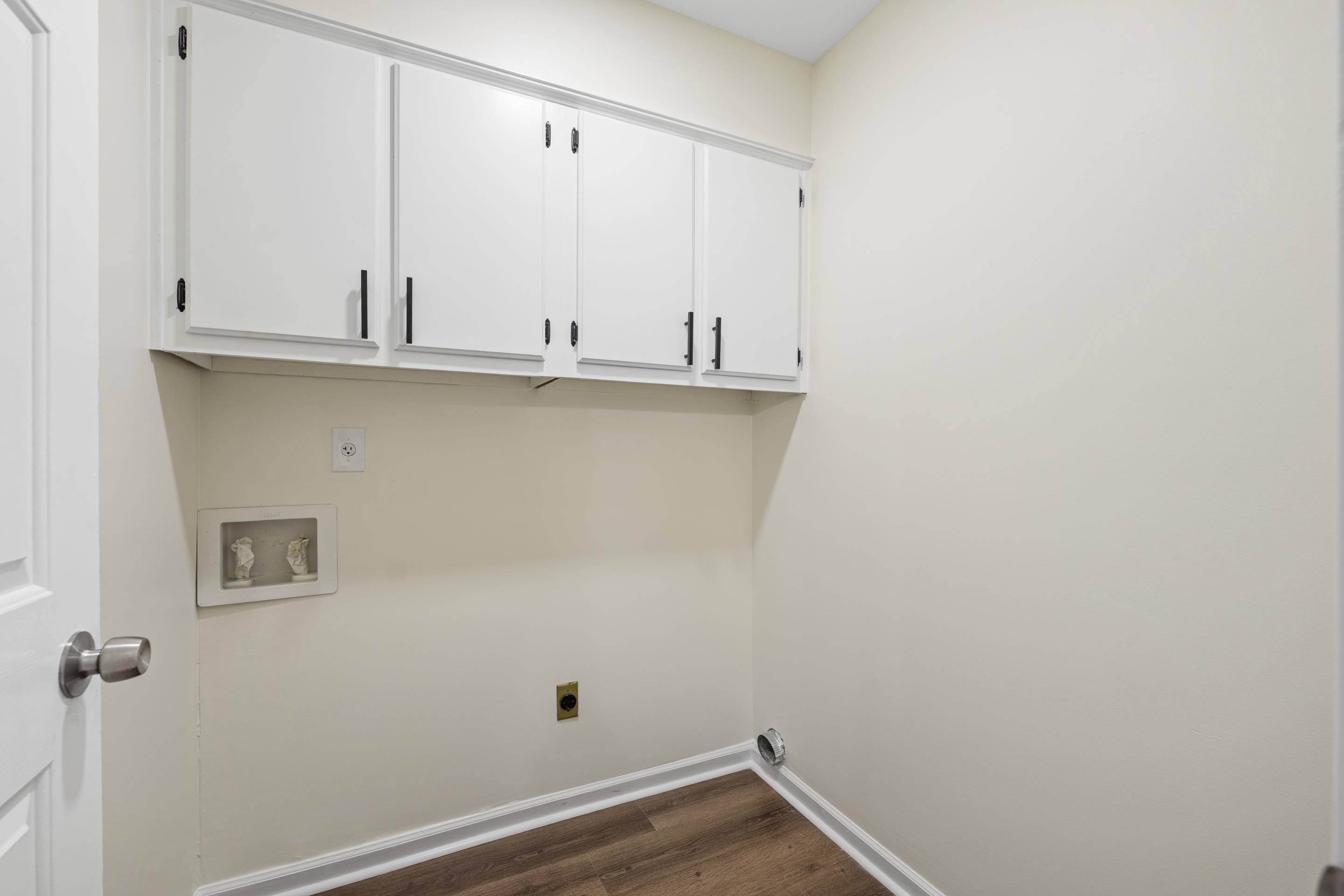 6400 Saginaw Road Memphis, TN 38134 - Photo 22 of 27 Separate laundry room with built-in cabinetry providing valuable storage and organization space for everyday convenience.
