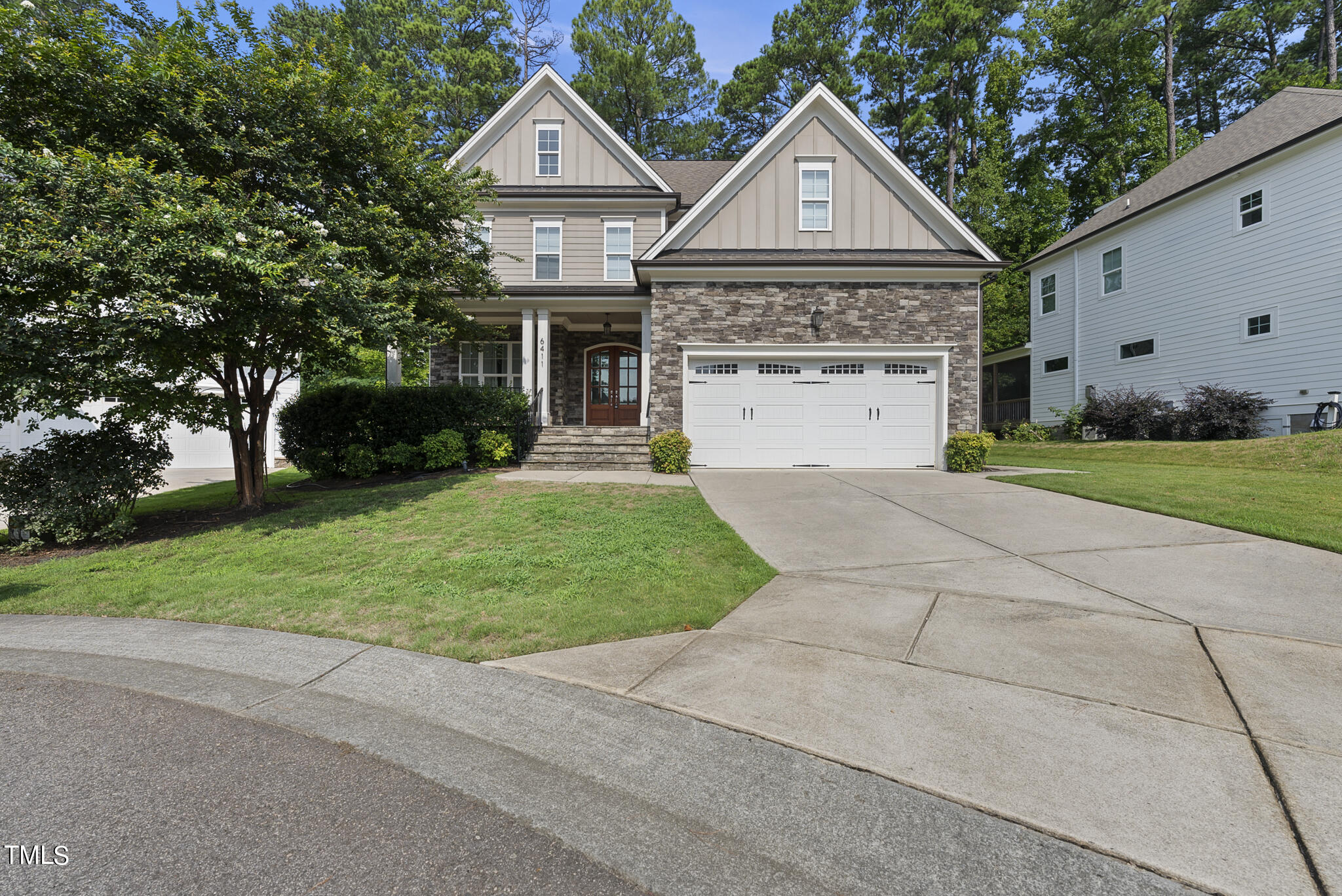 6411 Rosny Road Raleigh, NC 27613 - Photo 1 of 30 a front view of a house with a yard and garage