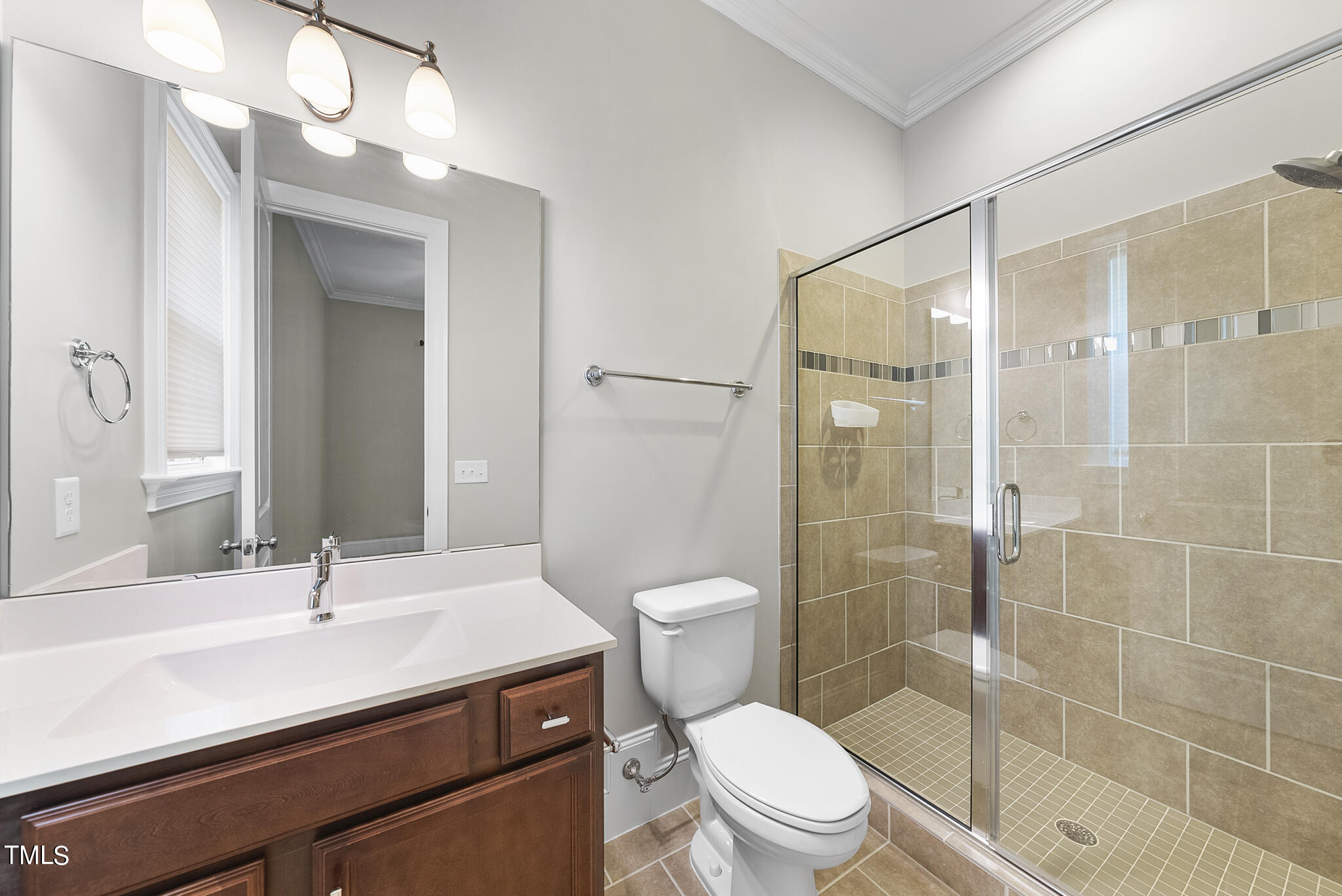 6411 Rosny Road Raleigh, NC 27613 - Photo 20 of 30 a bathroom with a sink a toilet and shower