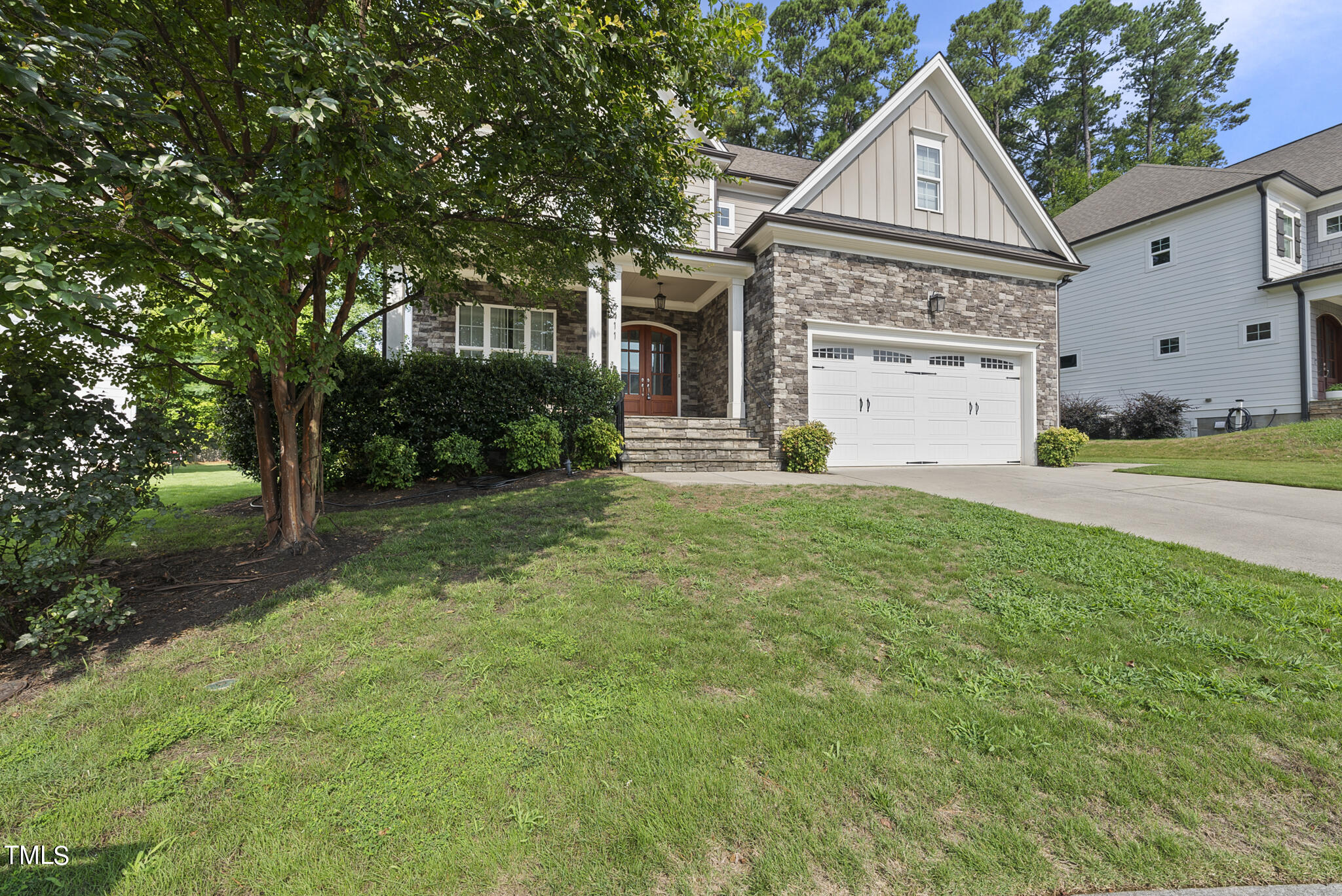 6411 Rosny Road Raleigh, NC 27613 - Photo 2 of 30 a front view of a house with a yard and trees