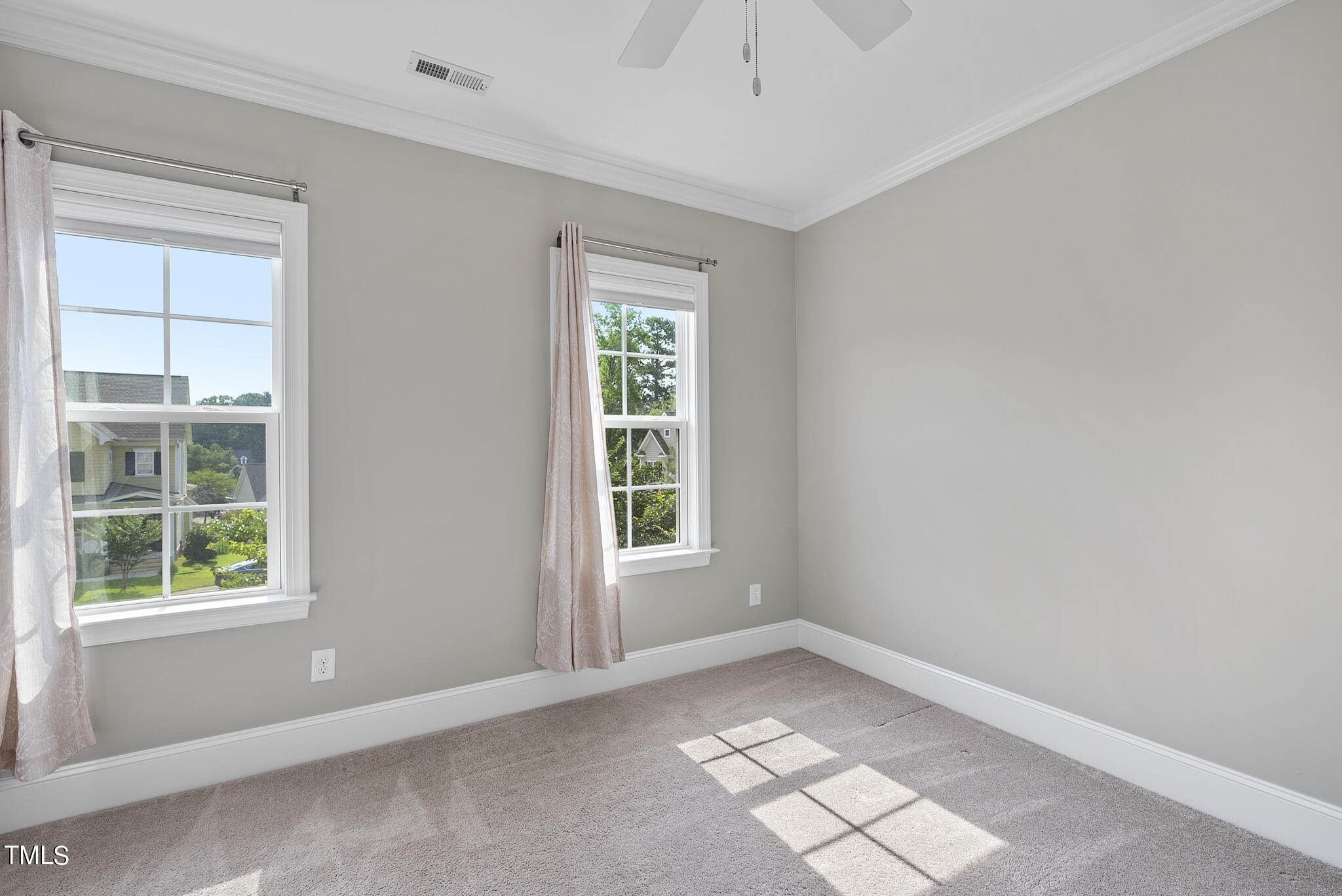 6411 Rosny Road Raleigh, NC 27613 - Photo 26 of 30 an empty room with windows