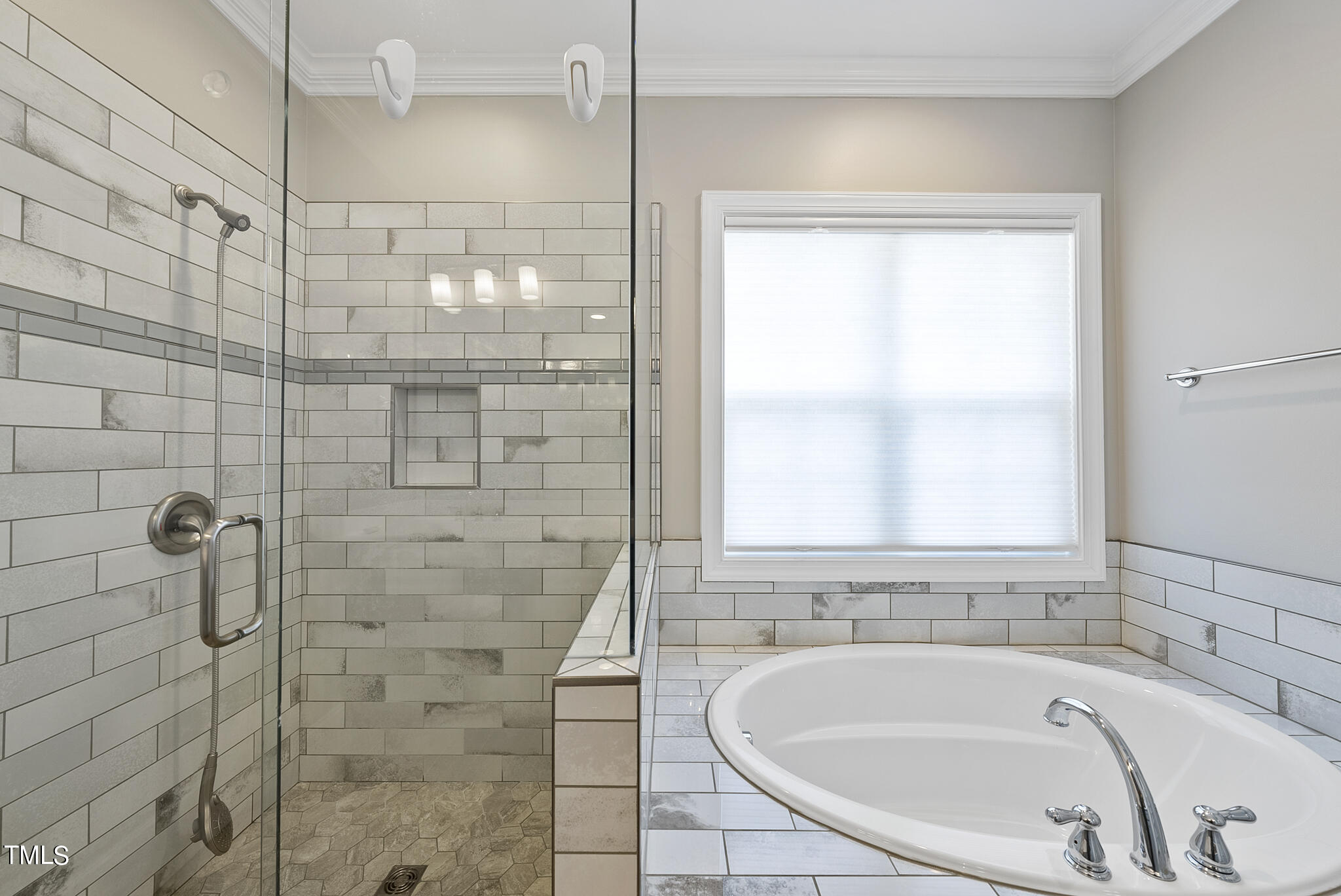 6411 Rosny Road Raleigh, NC 27613 - Photo 28 of 30 a bathroom with a bathtub and shower