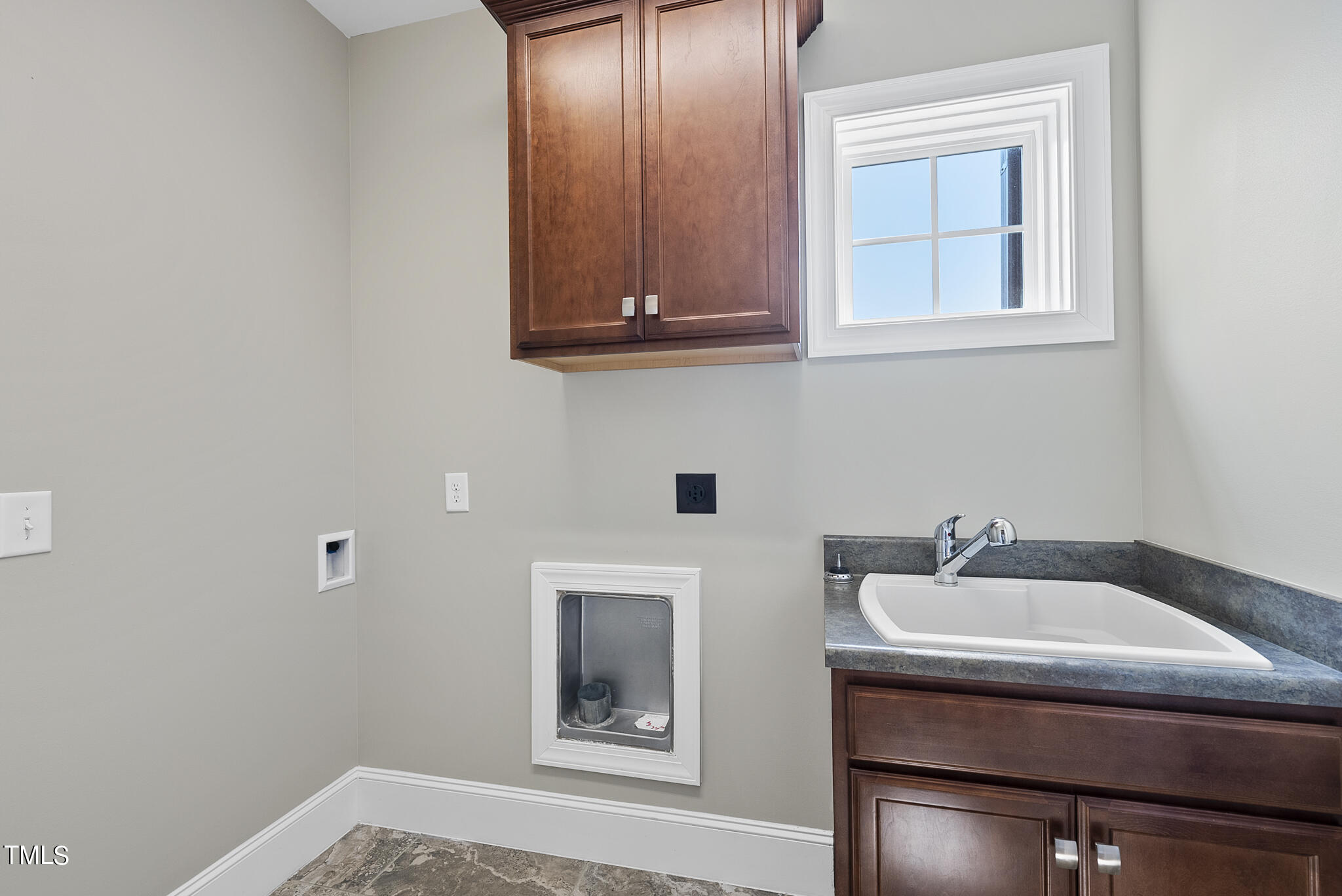 6411 Rosny Road Raleigh, NC 27613 - Photo 30 of 30 a bathroom with a sink and a mirror