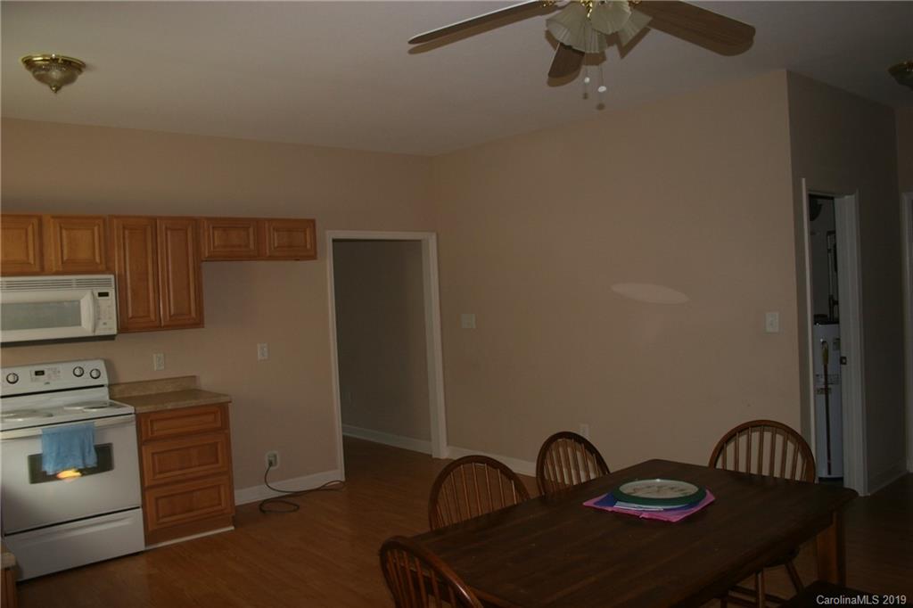 805 Stratford Road Troutman, NC 28166 - Photo 11 of 34 a view of a kitchen with appliances and furniture
