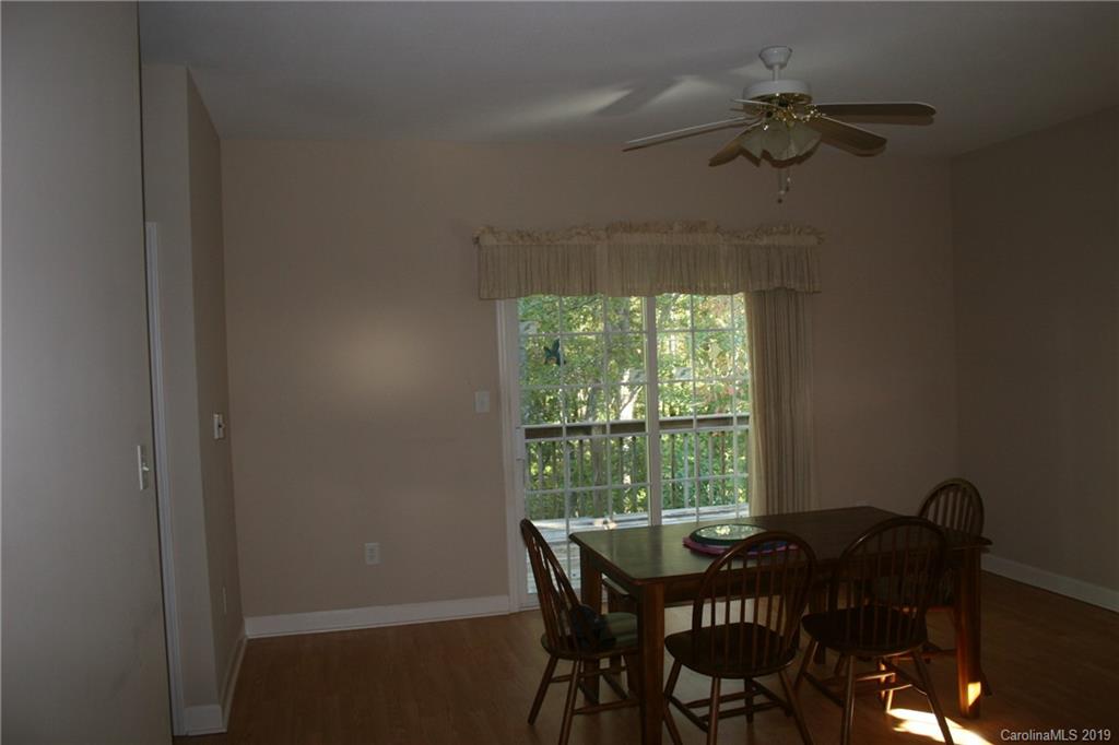 805 Stratford Road Troutman, NC 28166 - Photo 12 of 34 a view of a dining room with furniture and window