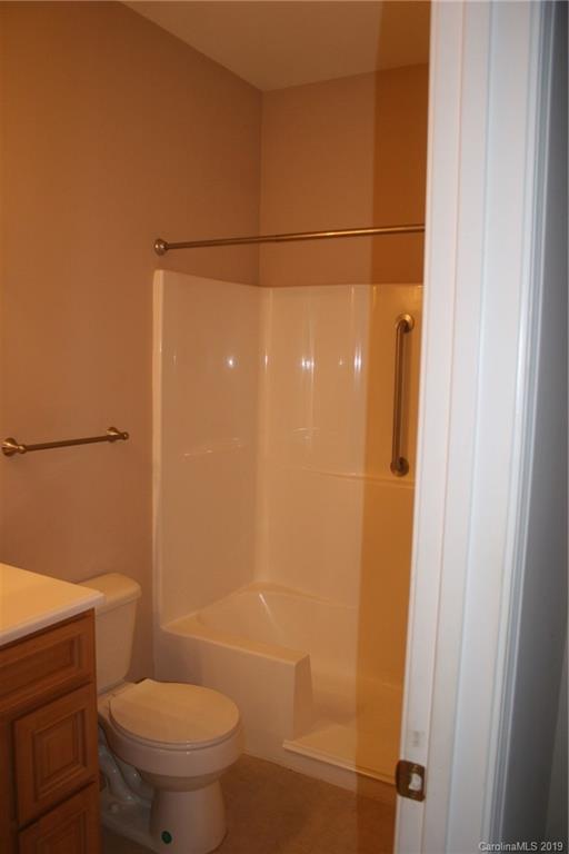 805 Stratford Road Troutman, NC 28166 - Photo 18 of 34 a bathroom with a toilet and a shower