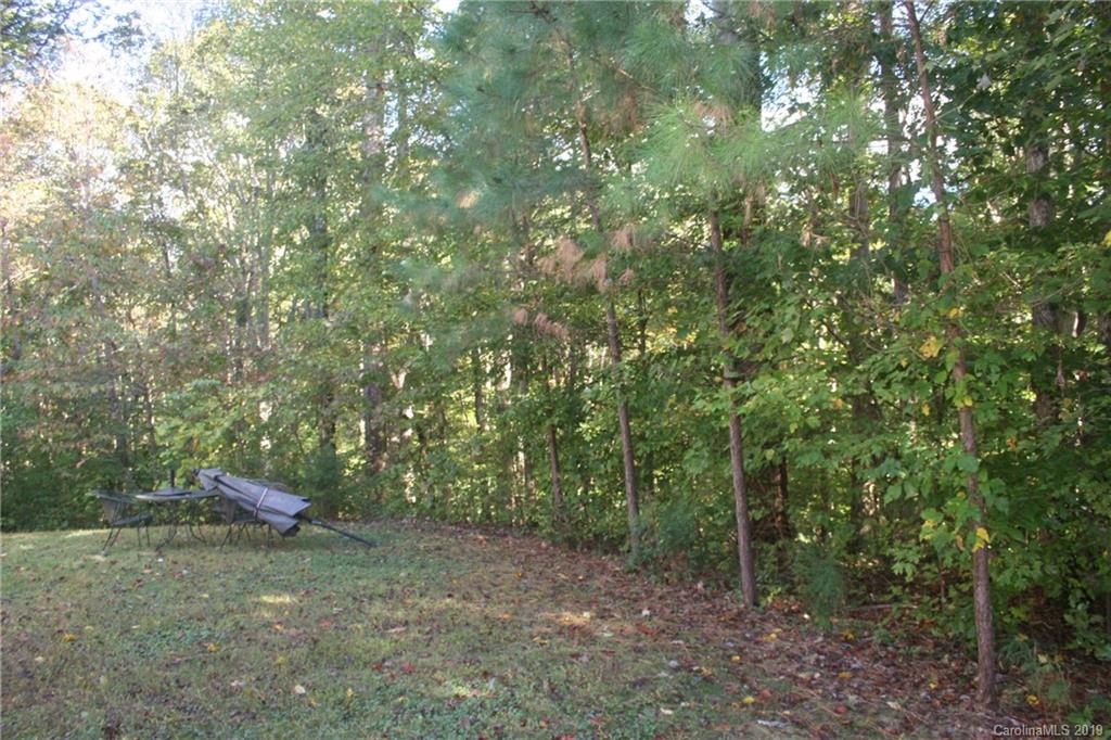805 Stratford Road Troutman, NC 28166 - Photo 3 of 34 a backyard of a house with lots of green space
