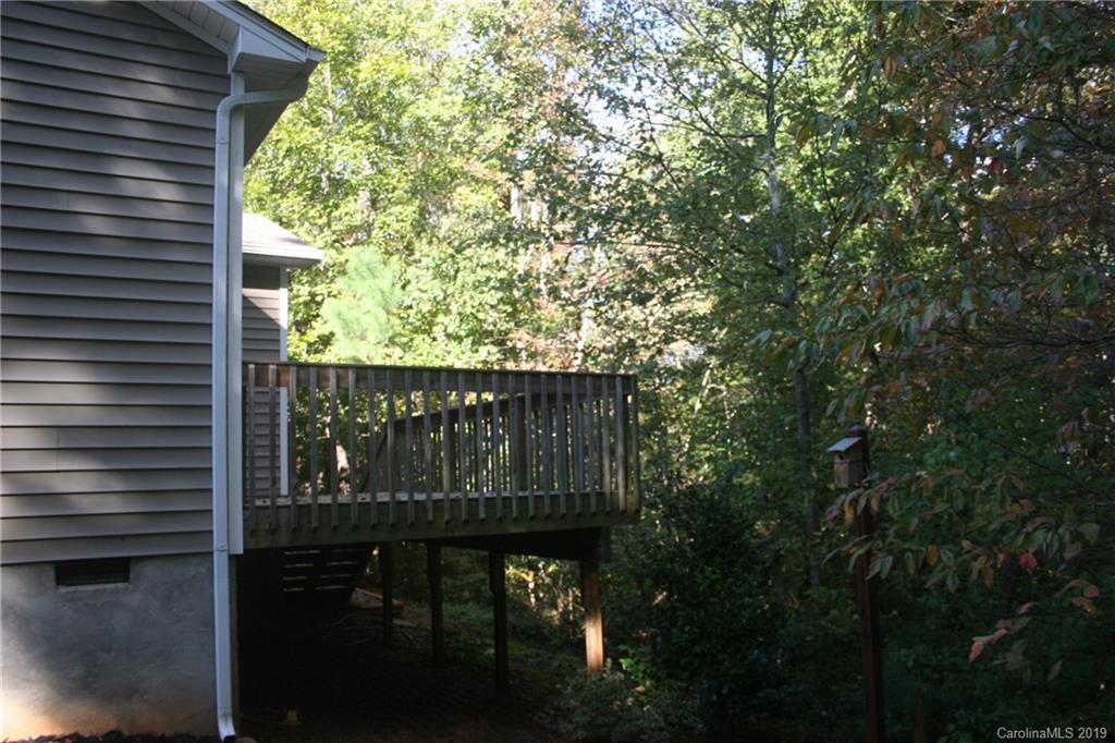 805 Stratford Road Troutman, NC 28166 - Photo 4 of 34 a wooden fence with a tree