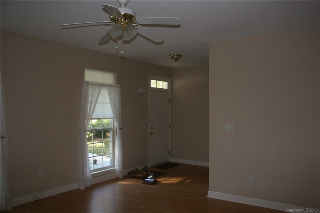 805 Stratford Road Troutman, NC 28166 - Photo 8 of 34 a view of an empty room with a window