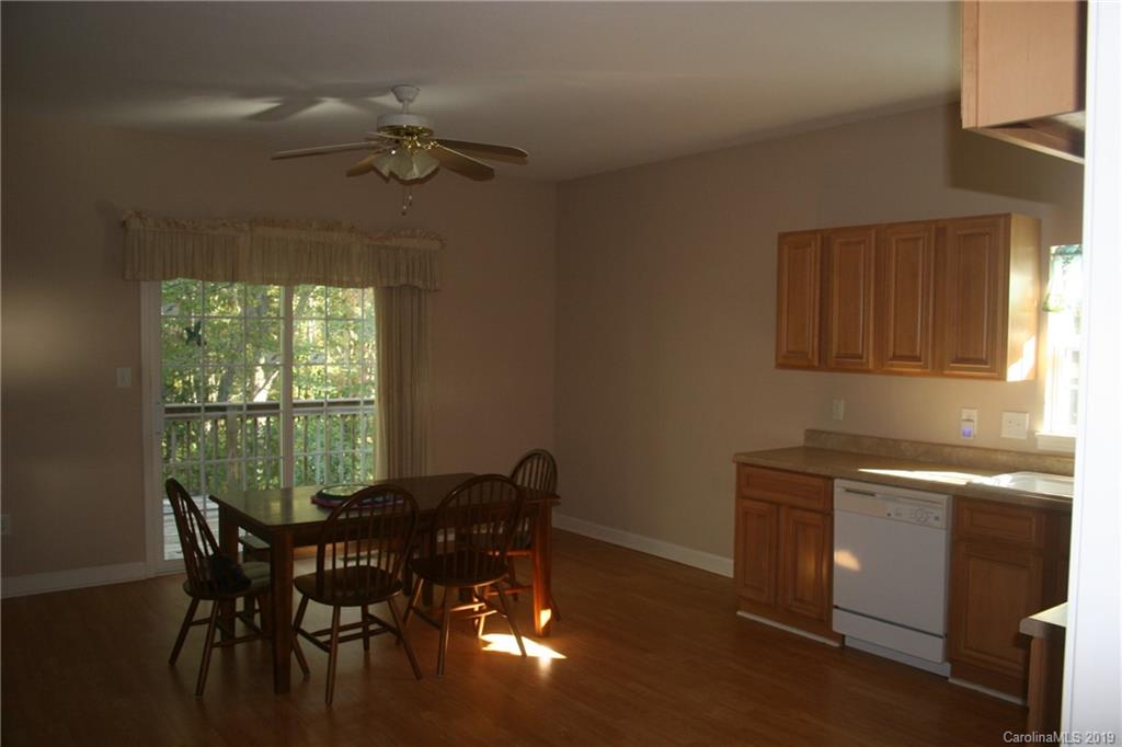 805 Stratford Road Troutman, NC 28166 - Photo 9 of 34 a view of a dining room with furniture and a window