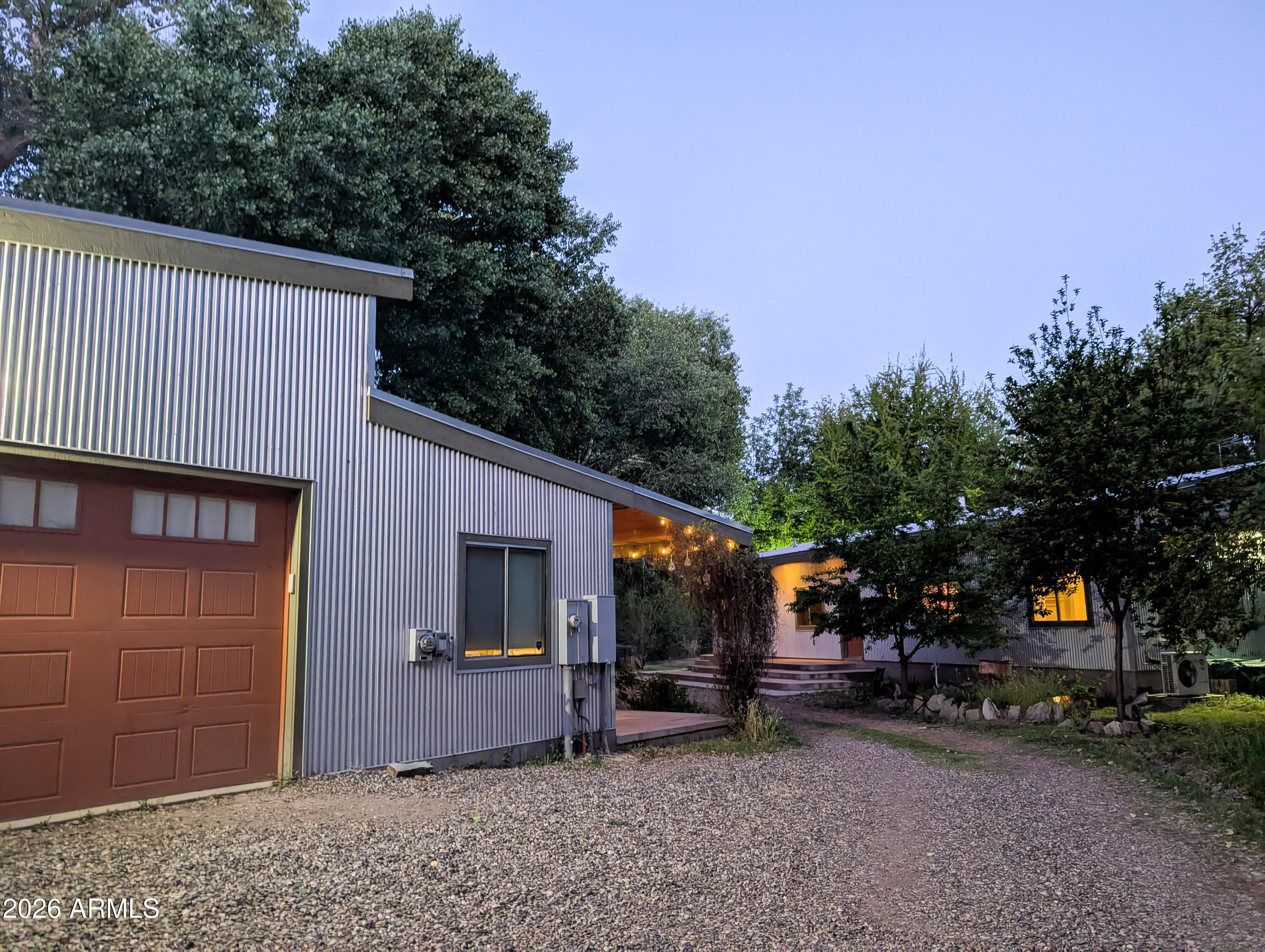 1165 North Willard Road Cottonwood, AZ 86326 - Photo 119 of 122 a view of a house with a patio and a fire pit