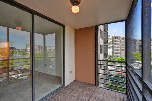 a view of a glass door with a balcony
