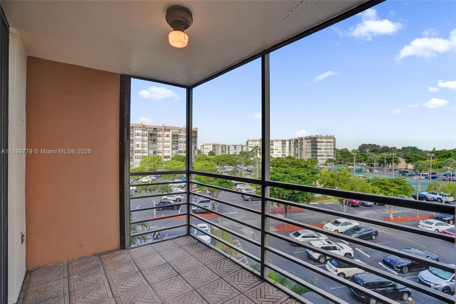 1200 St Charles Place, Unit 413 Pembroke Pines, FL 33026 - Photo 22 of 34 a view of a balcony with furniture