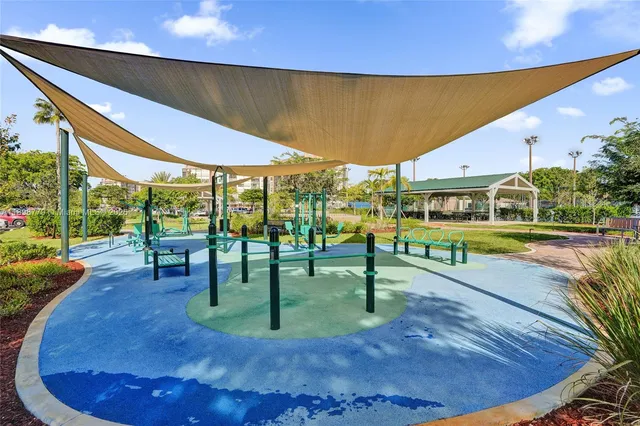 a swimming pool with chairs in front of it