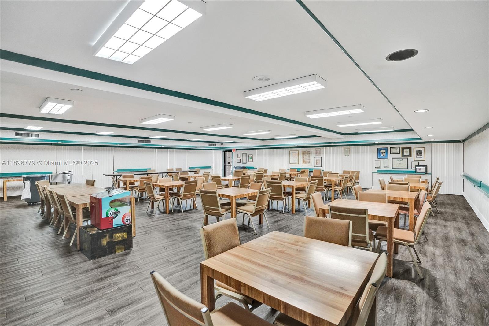 1200 St Charles Place, Unit 413 Pembroke Pines, FL 33026 - Photo 33 of 34 a living room with lots of furniture and a chandelier