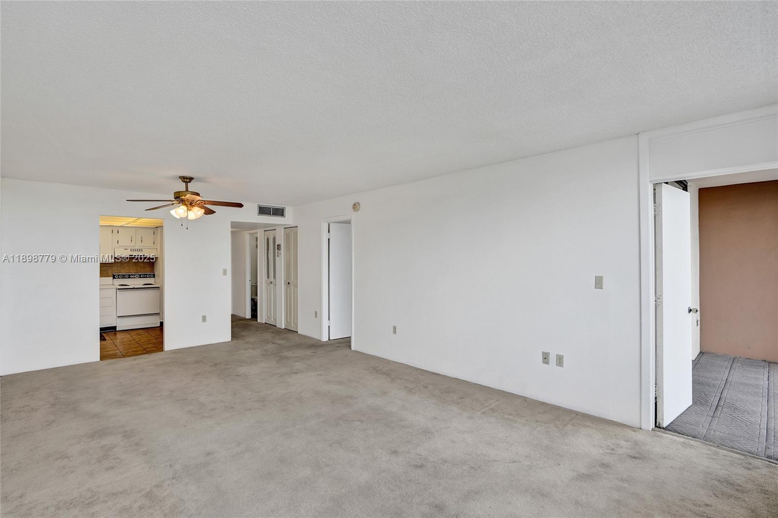 1200 St Charles Place, Unit 413 Pembroke Pines, FL 33026 - Photo 9 of 34 wooden floor in an empty room