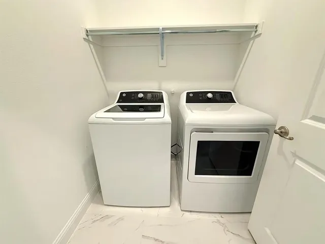 a utility room with dryer and washer