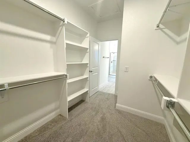 a view of an empty walk in closet