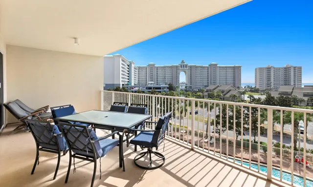 a view of a balcony with furniture