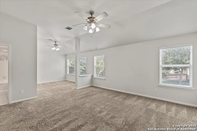 a view of an empty room with a window