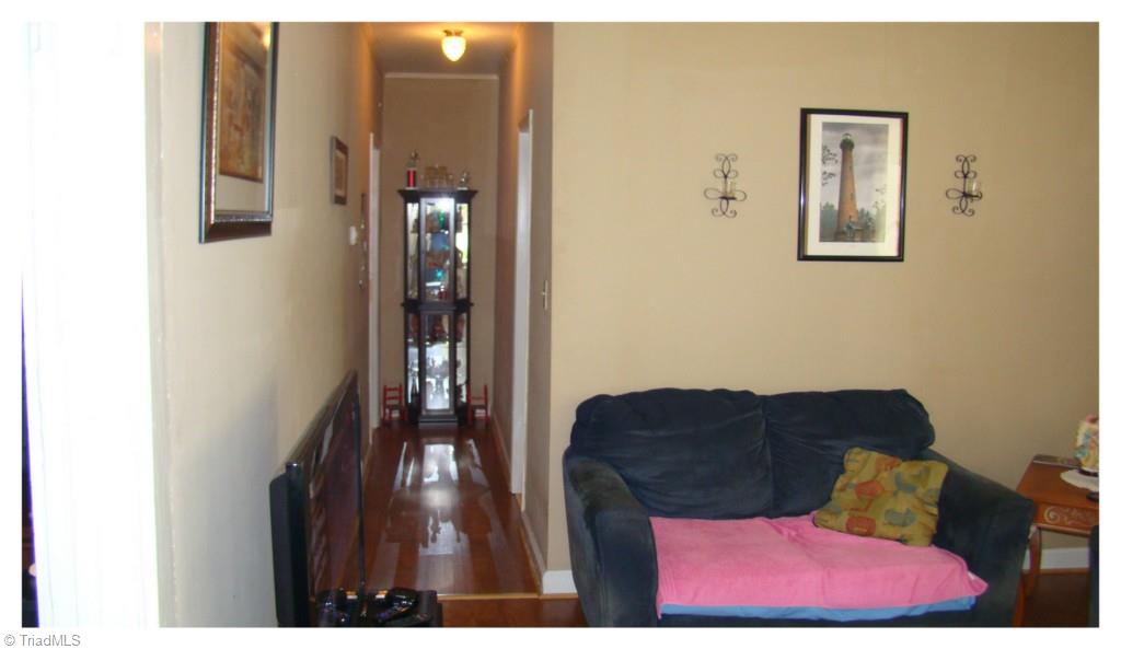 1909 Sheldon Road Greensboro, NC 27405 - Photo 8 of 20 Living room into hallway