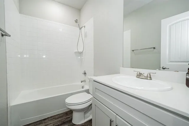 a bathroom with a sink a toilet and a bathtub