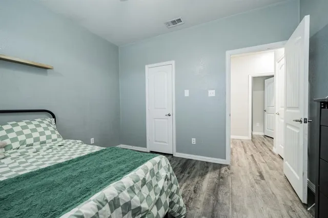 a bedroom with a bed and a view of bedroom