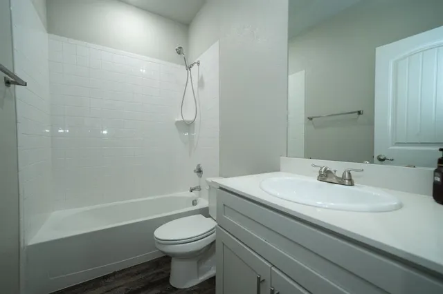 a bathroom with a sink a toilet and a bathtub