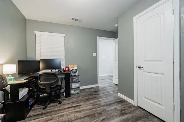 a workspace with furniture and wooden floor