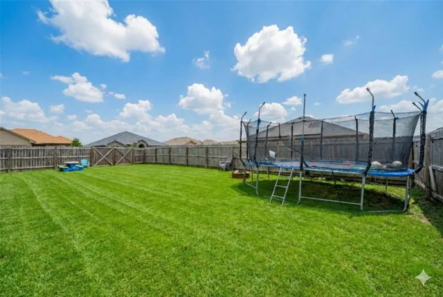 a view of a chair and tables in the garden