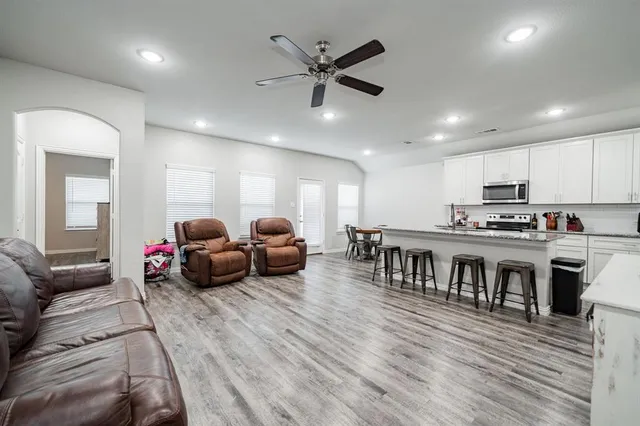 a living room with furniture kitchen and kitchen view