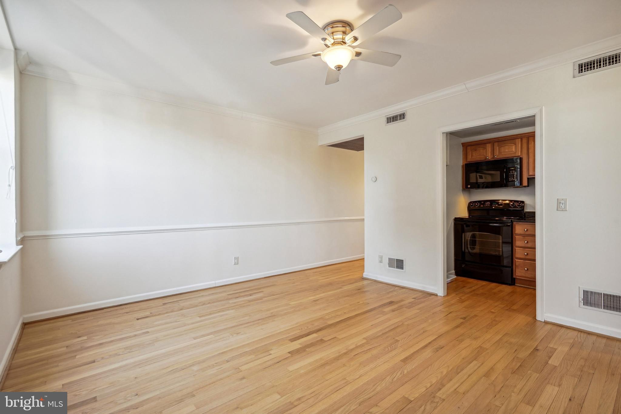 2611 Adams Mill Road Northwest, Unit 307 Washington, DC 20009 - Photo 6 of 16 Living room Kitchen