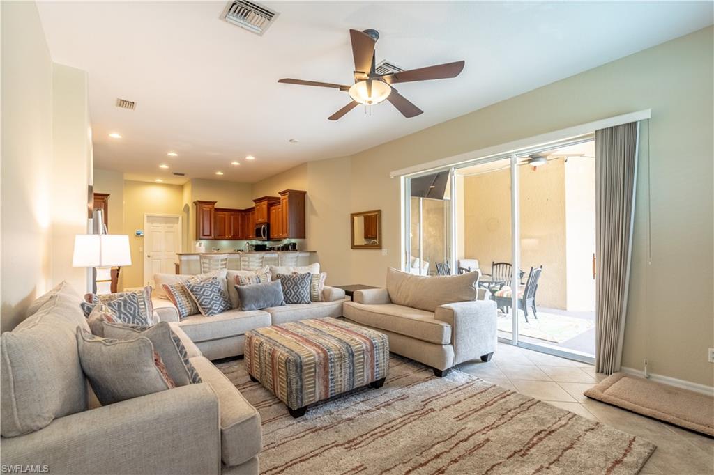 12414 Rock Ridge Lane Fort Myers, FL 33913 - Photo 14 of 48 a living room with couches and a view of kitchen