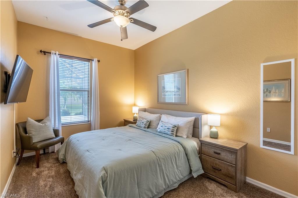 12414 Rock Ridge Lane Fort Myers, FL 33913 - Photo 21 of 48 a bedroom with a bed and wooden floor