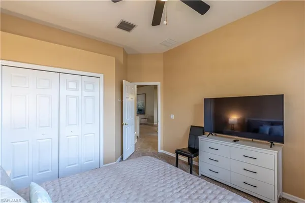 a bedroom with a flat screen tv