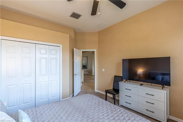 a bedroom with a flat screen tv
