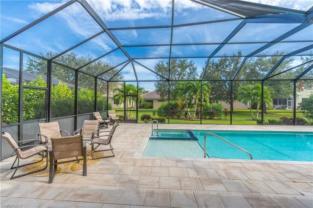 a view of a swimming pool with a patio