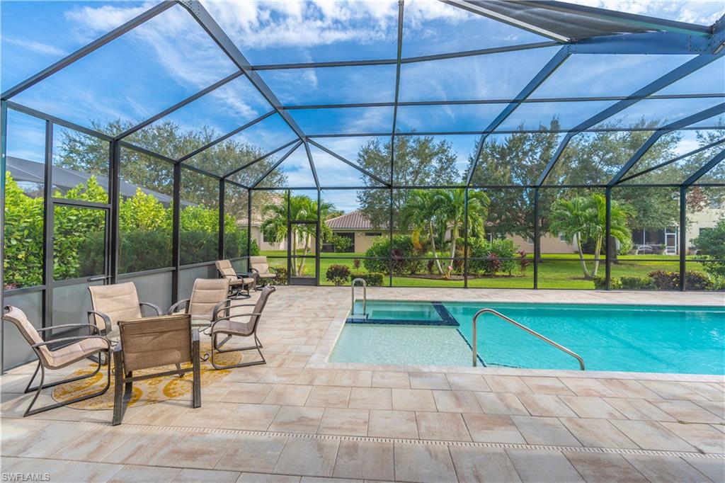 12414 Rock Ridge Lane Fort Myers, FL 33913 - Photo 29 of 48 a view of a swimming pool with a patio