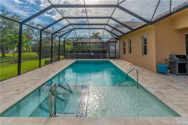 a view of a swimming pool with a patio