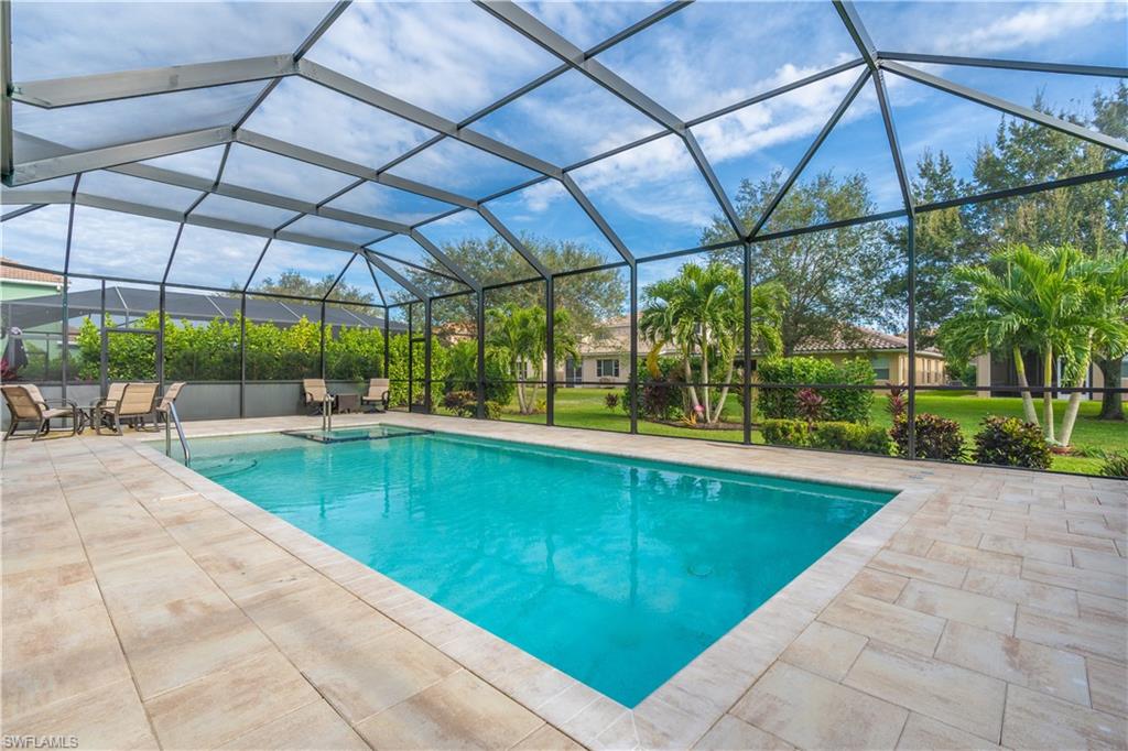 12414 Rock Ridge Lane Fort Myers, FL 33913 - Photo 32 of 48 a view of a swimming pool with a patio