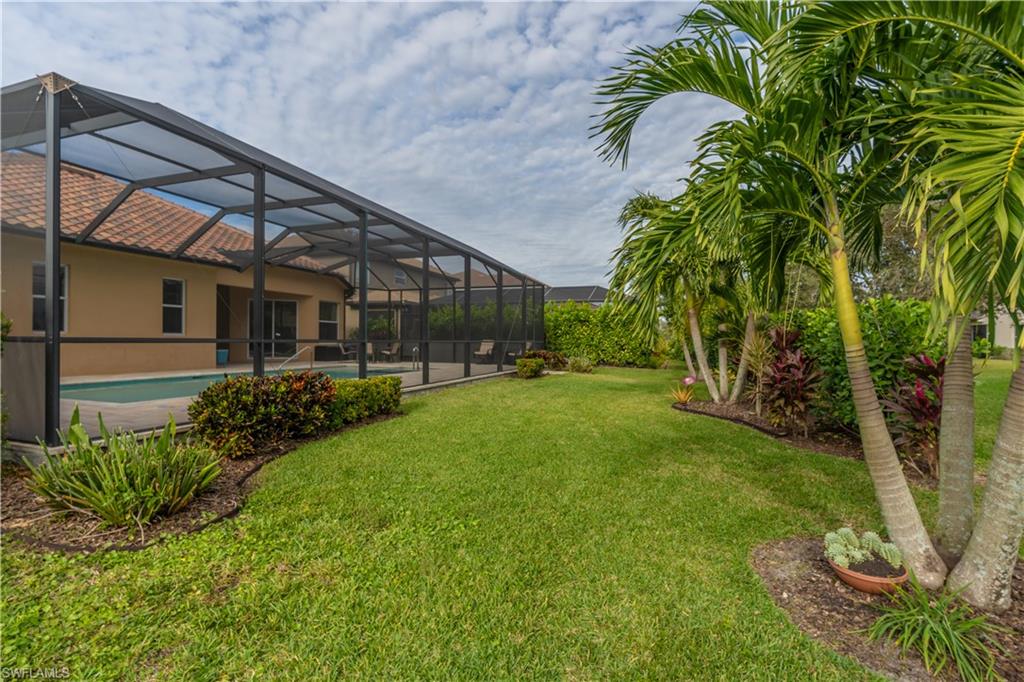 12414 Rock Ridge Lane Fort Myers, FL 33913 - Photo 35 of 48 a view of backyard with plants and a patio