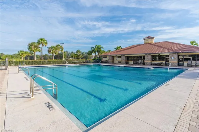 a view of a swimming pool with a yard