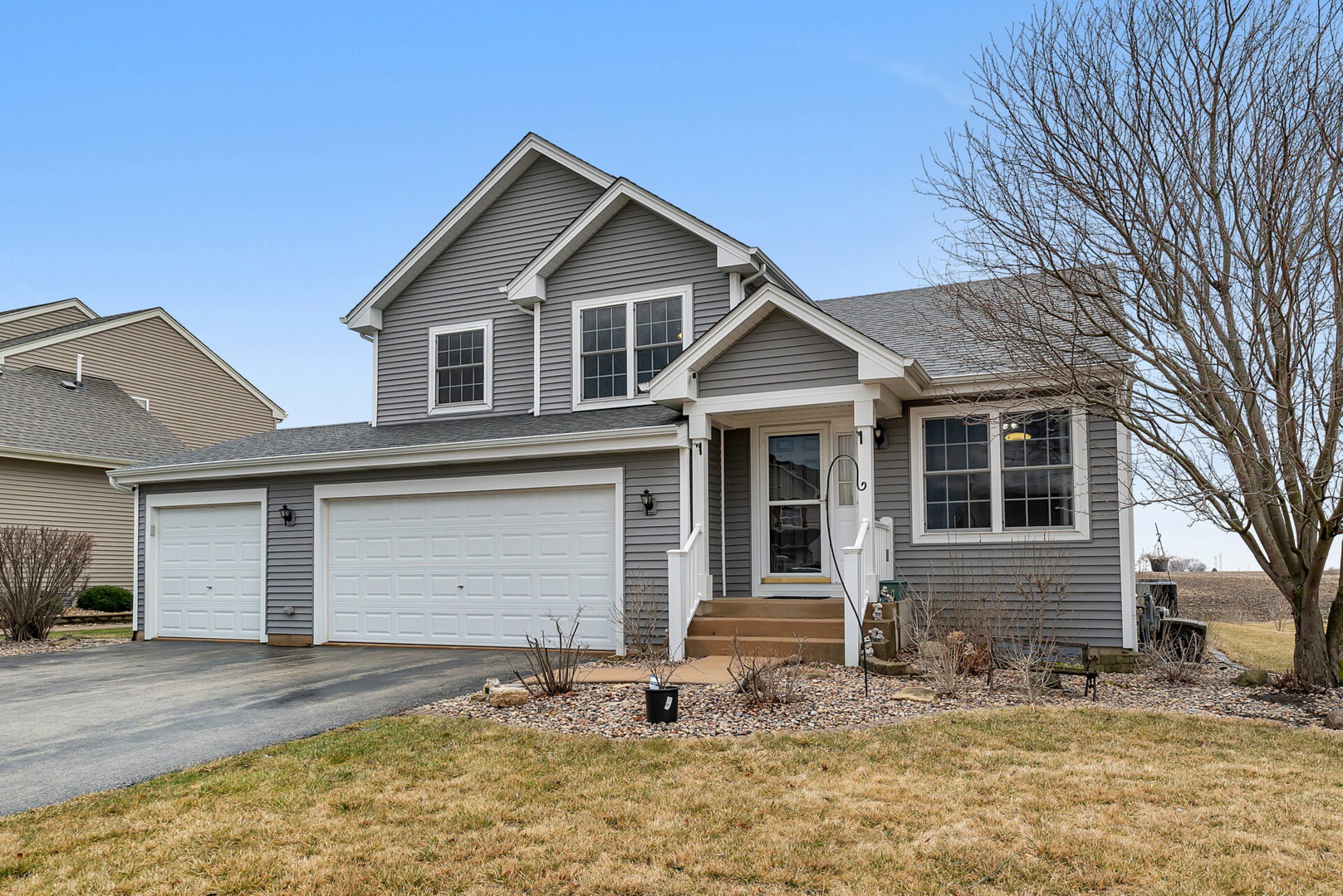 a front view of a house with garden