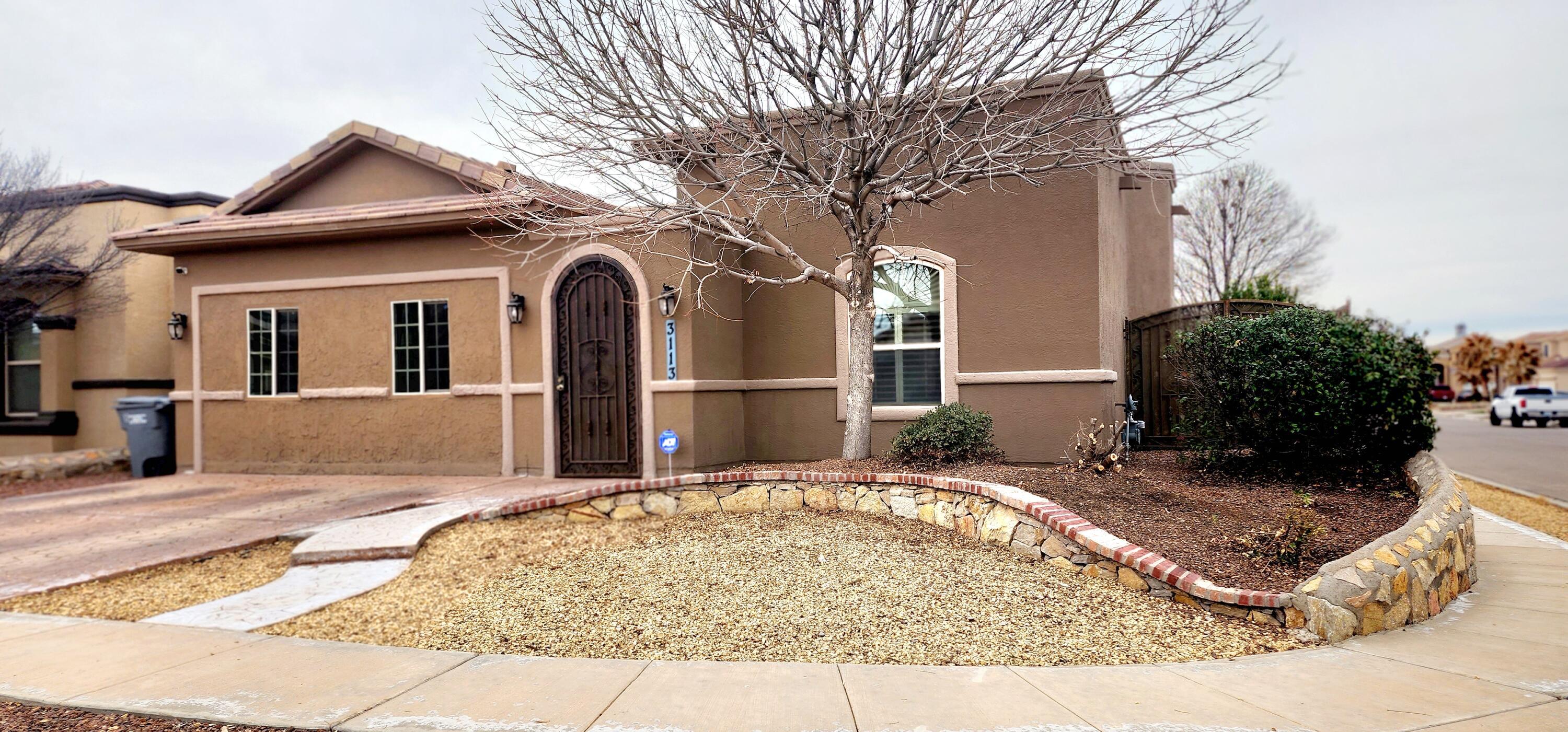 3113 Rustic Manor Place El Paso, TX 79938 - Photo 1 of 1 a front view of a house with garden