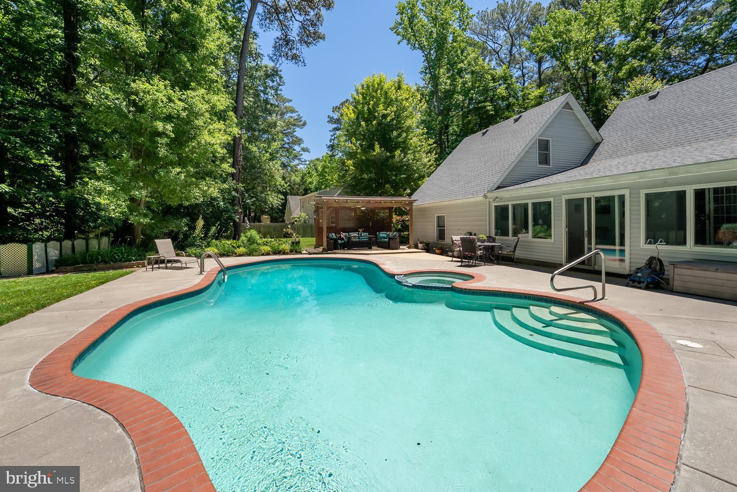 814 Wrights Neck Road Centreville, MD 21617 - Photo 15 of 53 a view of a house with swimming pool and porch